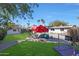 Inviting backyard with pool, patio furniture, and lush landscaping at 1125 E Northview Ave, Phoenix, AZ 85020