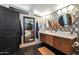 Modern bathroom with double vanity, hexagon tile floor, and stylish wall decor at 1125 E Northview Ave, Phoenix, AZ 85020