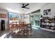 Mid-century modern dining room with a large table and access to backyard at 1125 E Northview Ave, Phoenix, AZ 85020