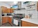 Bright kitchen with stainless steel appliances and wood cabinets at 1125 E Northview Ave, Phoenix, AZ 85020