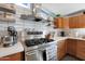 Updated kitchen featuring gas range and stainless steel hood at 1125 E Northview Ave, Phoenix, AZ 85020