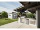 Outdoor kitchen with built-in grill, sink, and refrigerator at 1125 E Northview Ave, Phoenix, AZ 85020