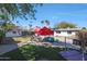 Relaxing pool area with patio furniture and a grassy backyard at 1125 E Northview Ave, Phoenix, AZ 85020