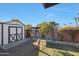 Storage shed and side yard with grassy area at 1125 E Northview Ave, Phoenix, AZ 85020