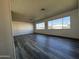 Spacious living room with grey vinyl flooring and large windows at 11411 N 91St Ave # 221, Peoria, AZ 85345