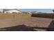 Expansive backyard space enclosed by a solid block wall, ready for landscaping at 12766 W Parkway Ln, Avondale, AZ 85323