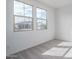 Bright bedroom with two large windows, neutral carpet, and abundant natural light at 12766 W Parkway Ln, Avondale, AZ 85323