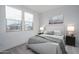 Cozy bedroom featuring bright light from two windows, plush carpet, and comfortable decor at 12766 W Parkway Ln, Avondale, AZ 85323