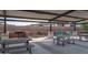 Community area featuring picnic tables, swings, and a built-in barbecue grill, perfect for outdoor gatherings at 12766 W Parkway Ln, Avondale, AZ 85323