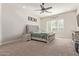 Main bedroom with plush carpeting and an elegant bed frame at 1301 E Ibis St, Gilbert, AZ 85297