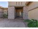 Front entry with stone columns and a wooden door at 1301 E Ibis St, Gilbert, AZ 85297