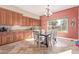 Kitchen nook with wood cabinetry and a built-in table at 1301 E Ibis St, Gilbert, AZ 85297