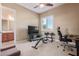 Home office with desk, chair, and workout equipment at 1301 E Ibis St, Gilbert, AZ 85297