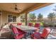 Covered patio with seating area overlooking the backyard at 1301 E Ibis St, Gilbert, AZ 85297