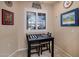 Cozy breakfast nook with small table and chairs, offering a view through a window at 13606 N 108Th Dr, Sun City, AZ 85351