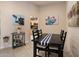 Bright dining area with a table, chairs, and kitchen views at 13606 N 108Th Dr, Sun City, AZ 85351