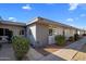 Inviting exterior of a condo building with landscaping and walkway at 13606 N 108Th Dr, Sun City, AZ 85351