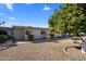 Exterior of home with a large citrus tree at 13606 N 108Th Dr, Sun City, AZ 85351