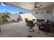 Relaxing patio with seating area, providing a covered space to unwind at 13606 N 108Th Dr, Sun City, AZ 85351