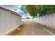 Large backyard with shed and wooden fence at 143 N 88Th Pl, Mesa, AZ 85207