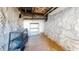 Unfinished basement with stone walls, shelving, and exposed pipes at 143 N 88Th Pl, Mesa, AZ 85207