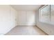 Simple carpeted bedroom with a closet and window at 143 N 88Th Pl, Mesa, AZ 85207