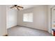 Well lit bedroom with carpeted floor and window with blinds at 143 N 88Th Pl, Mesa, AZ 85207