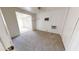 Bedroom featuring carpeted floor, window, and wall unit AC at 143 N 88Th Pl, Mesa, AZ 85207