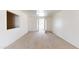 Living room with a view of the front entry and patio at 143 N 88Th Pl, Mesa, AZ 85207