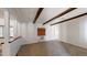 Carpeted living room with wood beam accents and window at 143 N 88Th Pl, Mesa, AZ 85207