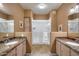 Double vanity bathroom with granite countertops and large shower at 15050 N Thompson Peak Pkwy # 1059, Scottsdale, AZ 85260