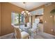 Dining area with glass table and view to kitchen at 15050 N Thompson Peak Pkwy # 1059, Scottsdale, AZ 85260