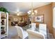 Bright dining area with glass table and chandelier at 15050 N Thompson Peak Pkwy # 1059, Scottsdale, AZ 85260