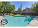 Community pool with a spa and lounge chairs at 15050 N Thompson Peak Pkwy # 1059, Scottsdale, AZ 85260