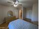 Comfortable bedroom with a dresser and ensuite bathroom at 15095 N Thompson Peak Pkwy # 1047, Scottsdale, AZ 85260