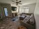 Bright living room featuring an L-shaped sofa and access to a patio at 15095 N Thompson Peak Pkwy # 1047, Scottsdale, AZ 85260