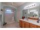 Bathroom with double vanity, shower and tile flooring at 16169 W Fairmount Ave, Goodyear, AZ 85395