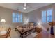 Guest bedroom with queen-size bed and wood furniture at 16169 W Fairmount Ave, Goodyear, AZ 85395