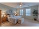 Main bedroom with king-size bed and calming color scheme at 16169 W Fairmount Ave, Goodyear, AZ 85395