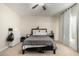 Bedroom with a double bed and dresser, featuring neutral decor at 16173 W Monroe St, Goodyear, AZ 85338