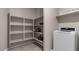 Laundry room with washer, dryer and shelving units at 18352 W Chama Dr, Wittmann, AZ 85361