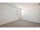 Empty bedroom with carpeted floor and single window at 18363 W Smoketree Dr, Wittmann, AZ 85361