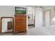 Bedroom with dresser, mirror, and view of bathroom at 1920 E Maryland Ave # 21, Phoenix, AZ 85016