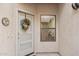 Front entrance with a wreath and a sidelight window offering natural light at 1920 E Maryland Ave # 21, Phoenix, AZ 85016