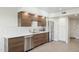 Modern kitchen with wood cabinets and stainless steel appliances at 1920 E Maryland Ave # 21, Phoenix, AZ 85016