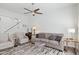 Living room with two armchairs, a sofa, and a ceiling fan at 1920 E Maryland Ave # 21, Phoenix, AZ 85016