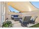 Cozy patio with shade sail and comfortable seating at 1920 E Maryland Ave # 21, Phoenix, AZ 85016