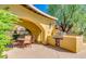 Community outdoor kitchen with grill and seating area at 20704 N 90Th Pl # 1008, Scottsdale, AZ 85255