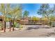 Gated entrance to a community with paved road and landscaping at 20704 N 90Th Pl # 1008, Scottsdale, AZ 85255