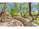 Stone pathway winds through a lush, tree-lined community area at 20704 N 90Th Pl # 1008, Scottsdale, AZ 85255